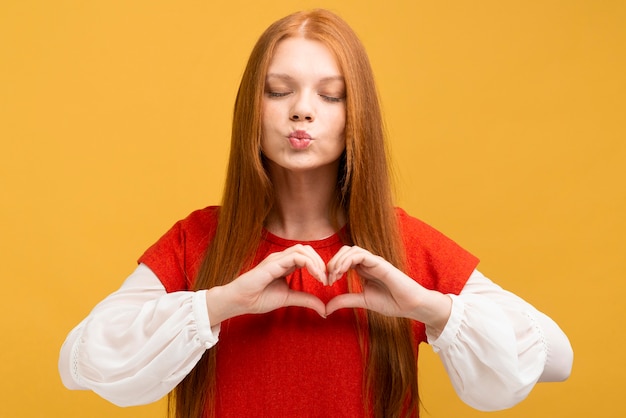 Medium shot woman with yellow background