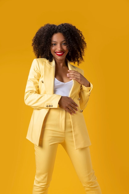 Medium shot woman with yellow background