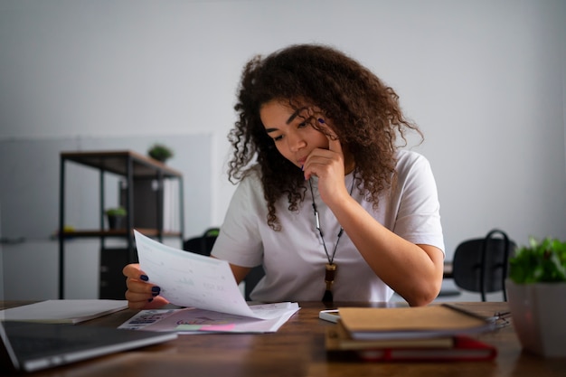 Medium shot woman working as economist