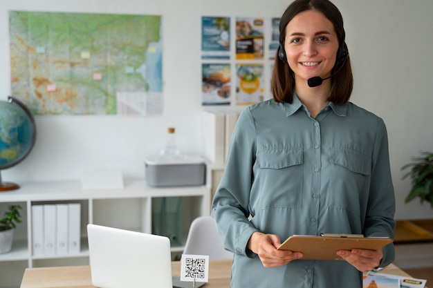 Medium shot woman working as a travel agent