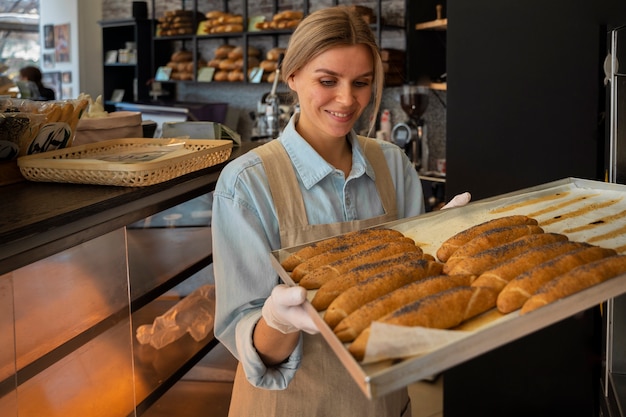 Medium shot woman working in bakery