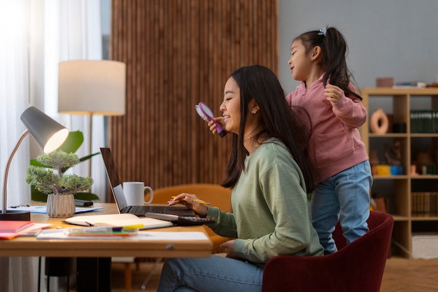 Medium shot woman working from home