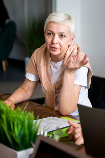 Medium shot woman working indoors