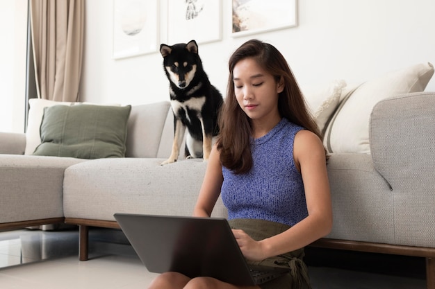 Medium shot woman working on laptop