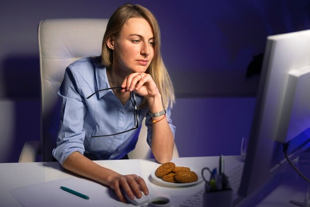 medium shot woman working late at night