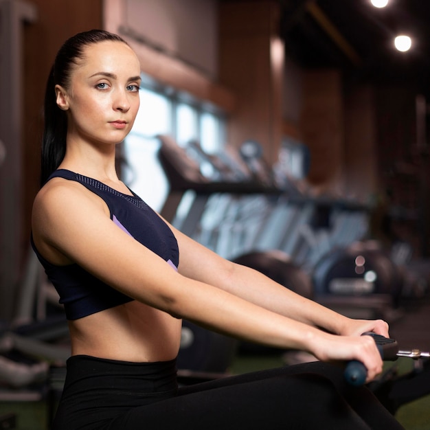 Medium shot woman working out