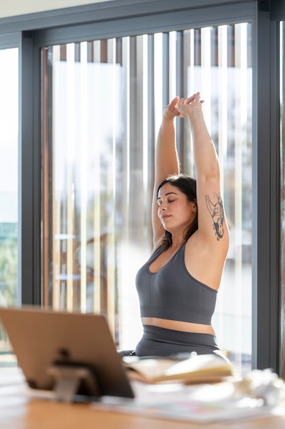 Medium shot woman working out