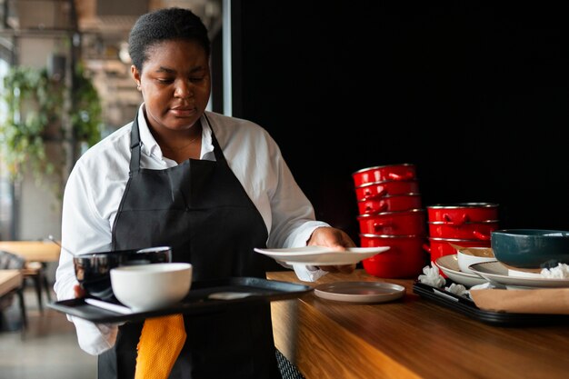 Medium shot woman working in service industry