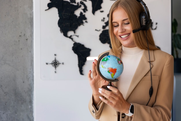 Medium shot woman working in travel agency