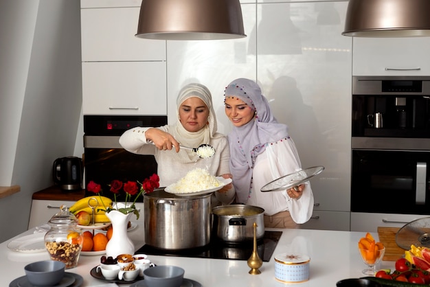 Medium shot women cooking for ramadan