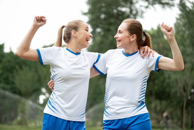 Medium shot women expressing victory