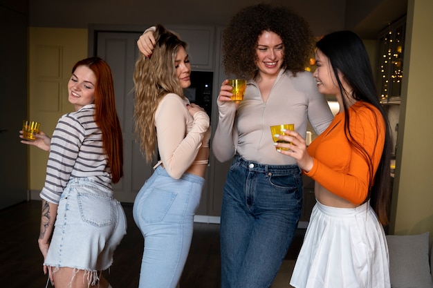 Free photo medium shot women having fun at party