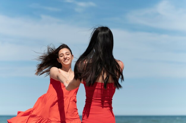 Medium shot women holding hands