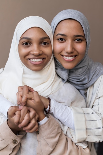 Medium shot women holding hands