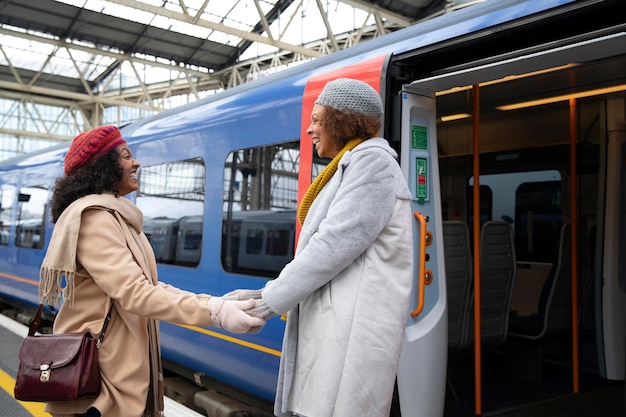 Medium shot women holding hands