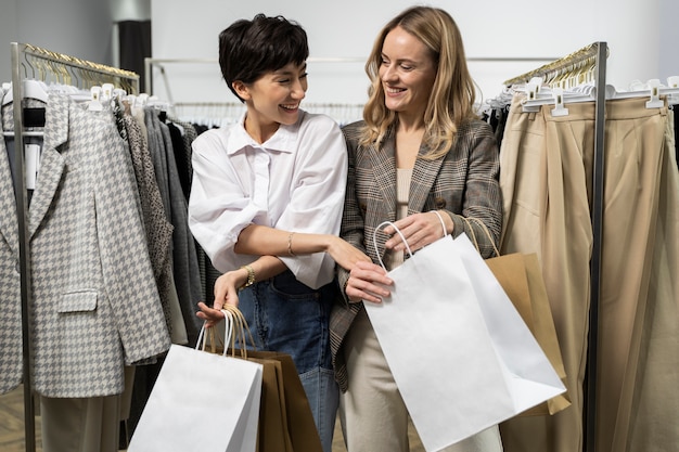 medium shot women holding shopping bags