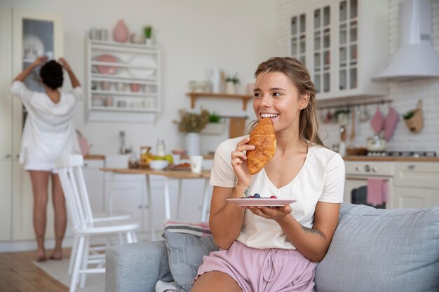 Medium shot women at home together