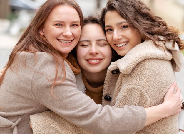 Medium shot women hugging