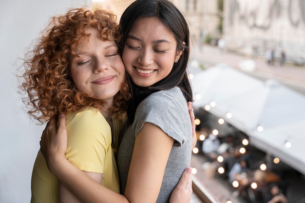 Medium shot women hugging