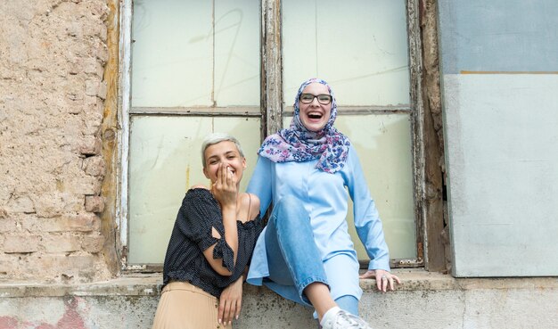 Medium shot of women laughing