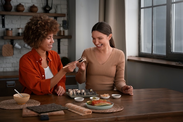 Medium Shot Women Learning to Make Sushi – Free Stock Photos