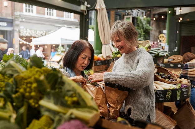 Medium shot women shopping food