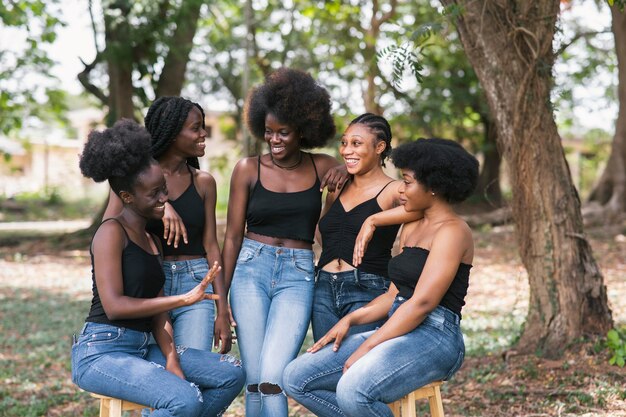 medium shot women sitting on chairs