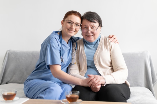 Medium shot women sitting on couch