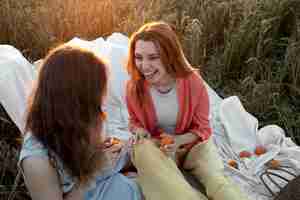 Free photo medium shot women sitting together