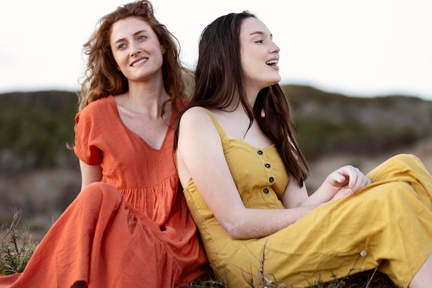 Free photo medium shot women sitting together