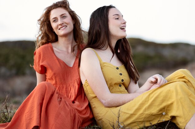 Medium shot women sitting together