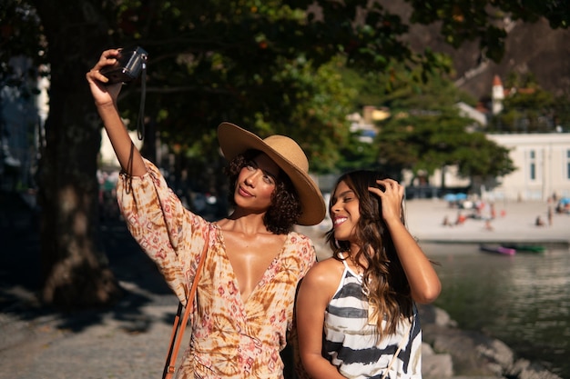 Medium shot women wearing vacation outfits