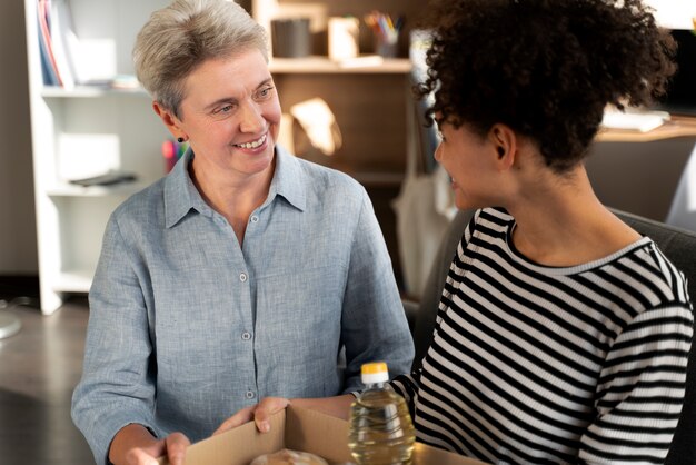 Medium shot women with donations