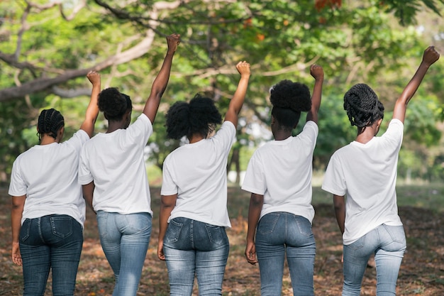 Medium shot women with fists up