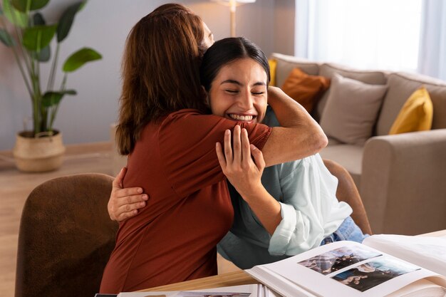 Medium shot women with picture albums