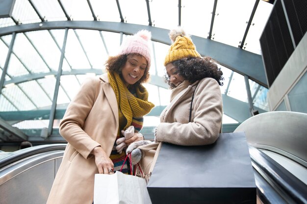 Medium shot women with shopping bags