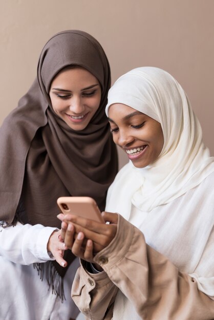 Medium shot women with smartphone