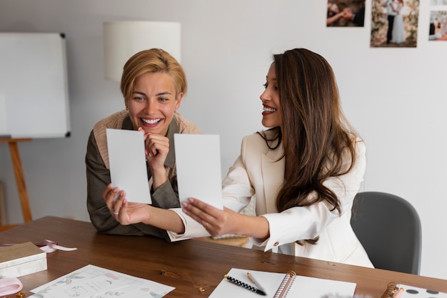 medium shot women working as wedding planners