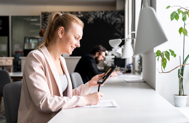 Medium shot workers at desk