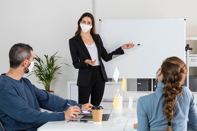 medium shot workers in meeting