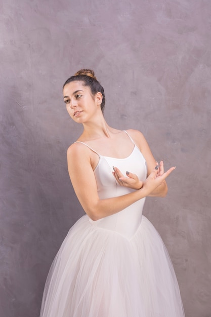 Free photo medium shot young ballerina looking away