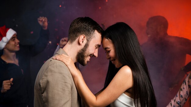 Medium shot of young couple dancing