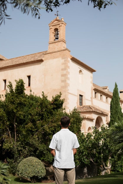 Medium shot young man praying