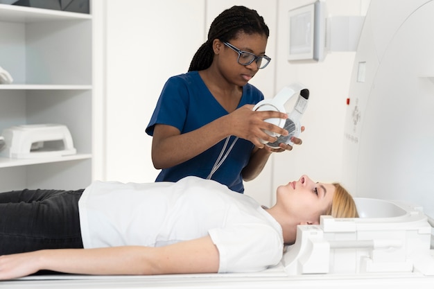 Medium shot young patient ready to get ct scan