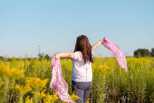 Medium shot of young woman in nature