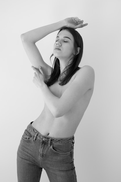 Medium shot young woman posing nude