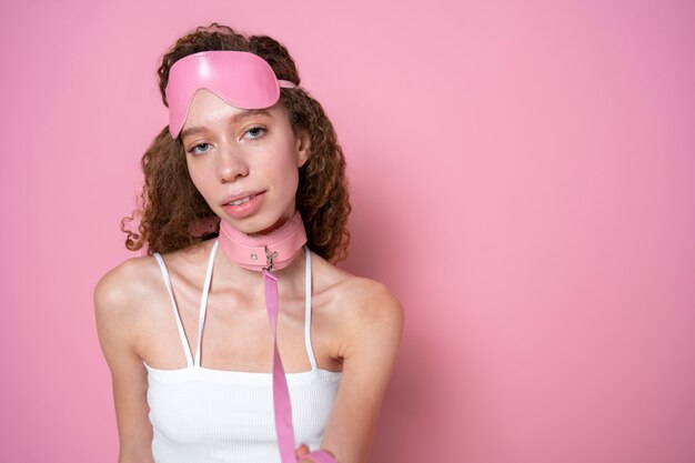 Medium shot young woman wearing pink chocker