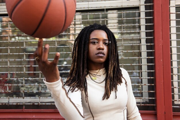 Medium shot young woman with ball