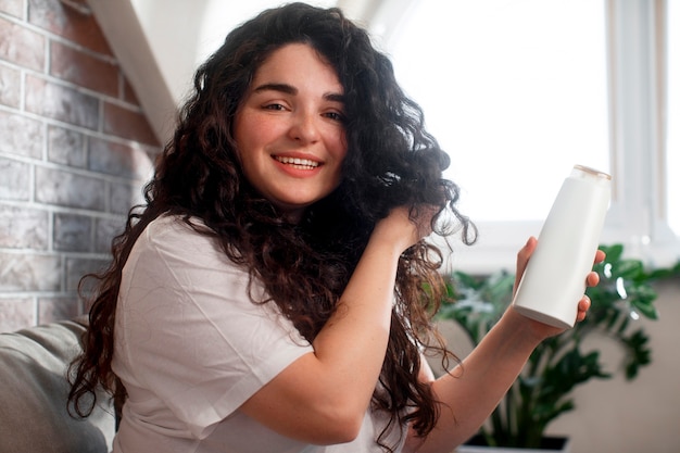 Medium shot young woman with curly hair