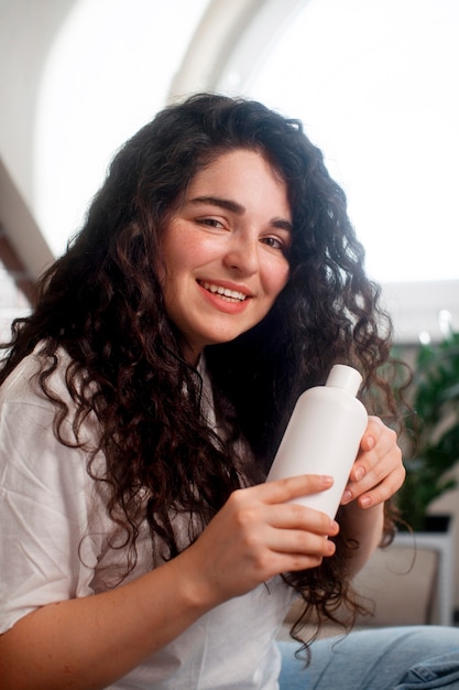 Medium shot young woman with curly hair